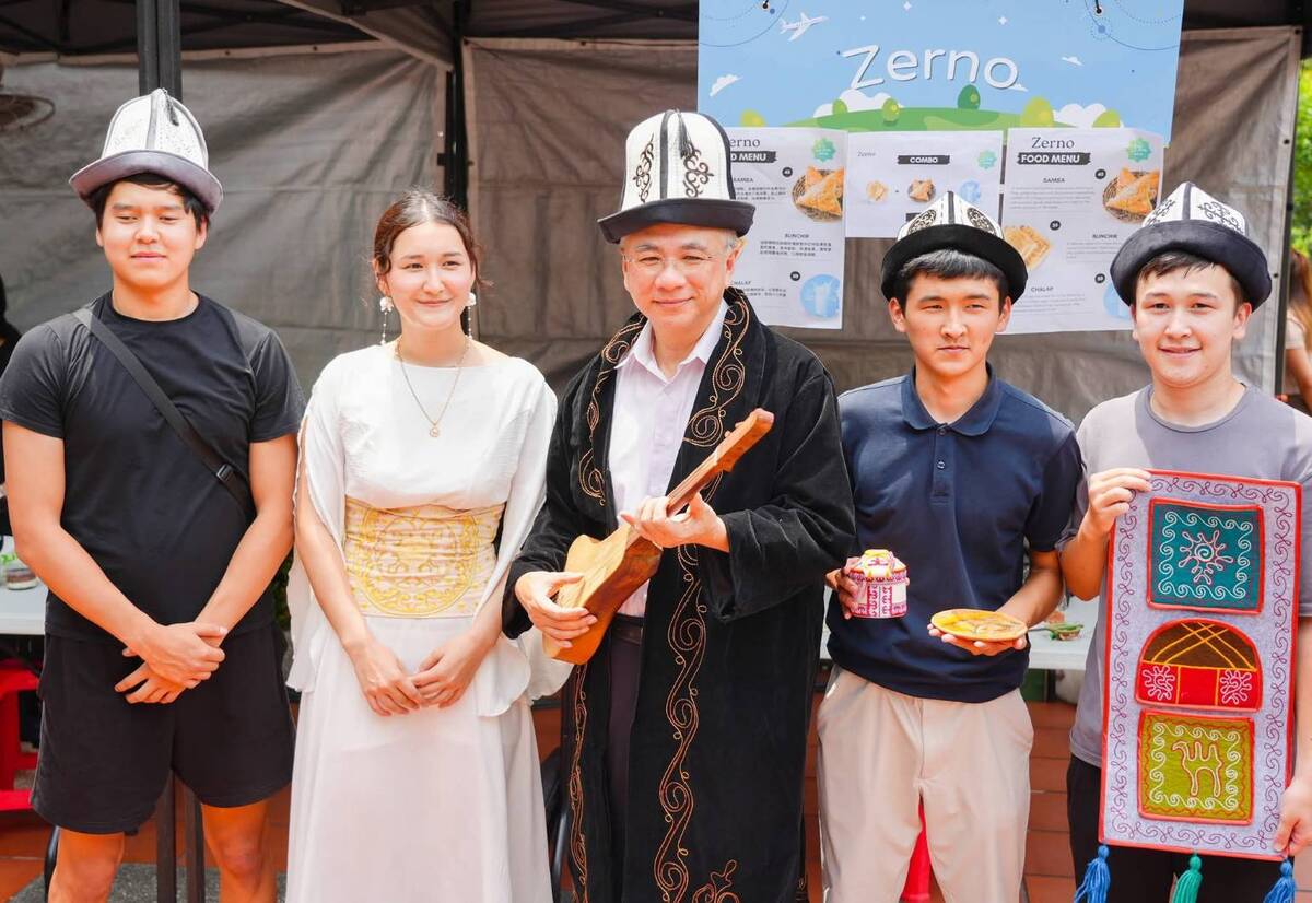 President Tao-Ming Cheng (center) poses with students from Kyrgyzstan.Image