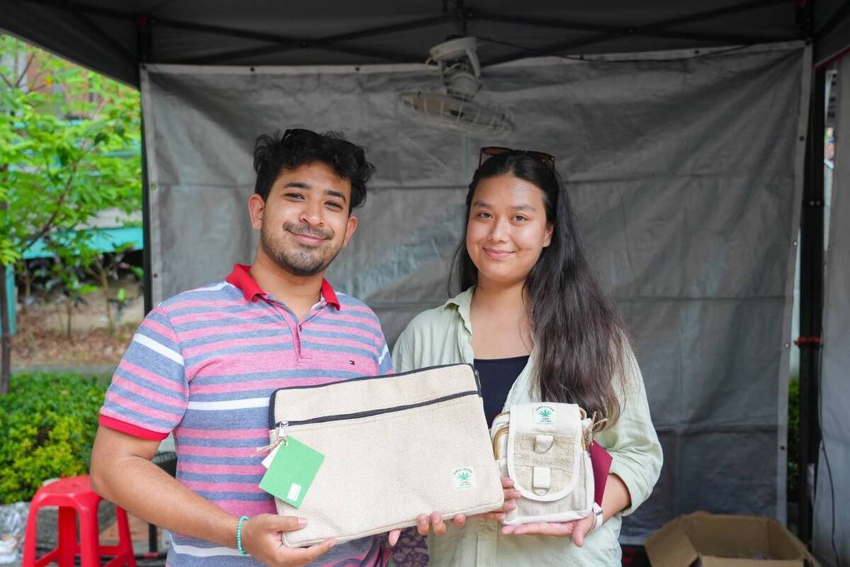 Nepalese students display handcrafted woven bags inspired by traditional designs.Image