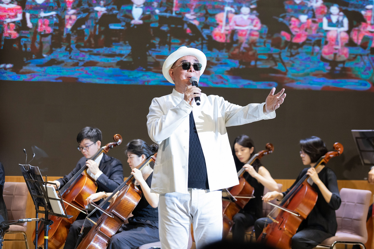 Chairman Wu performs classic Taiwanese songs at CYUT, showcasing his strong vocals.Image