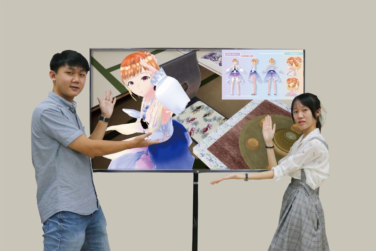Li Yi-Han (right) and Su Mu-En (left) from Information Management won gold in the Metaverse Virtual Idol Design Contest 2022.Image