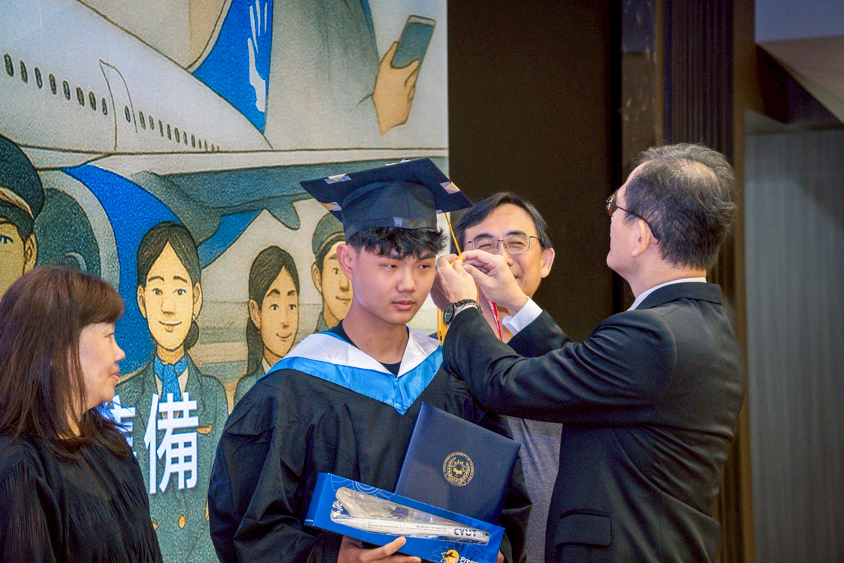 Dean Yu-Hsin Chang (right) turned tassels and removed the “Remove Before Flight” ribbons.Image