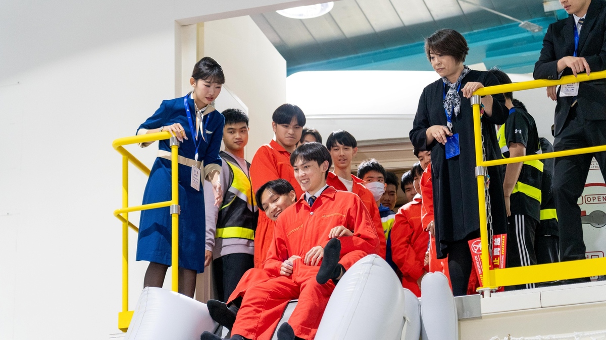 Cabin evacuation drills help students understand the importance of aviation safety.Image