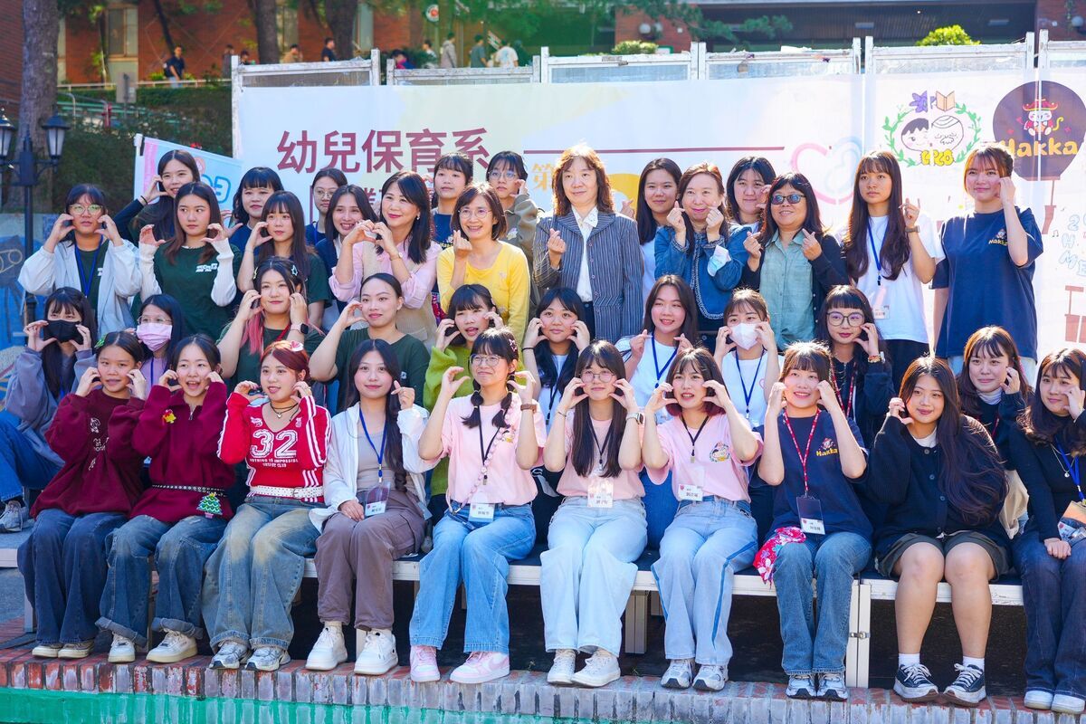 Graduating students pose for a group photo with Department Chair Hua-Huei Chiou (third row, 5th from right) and faculty members.Image