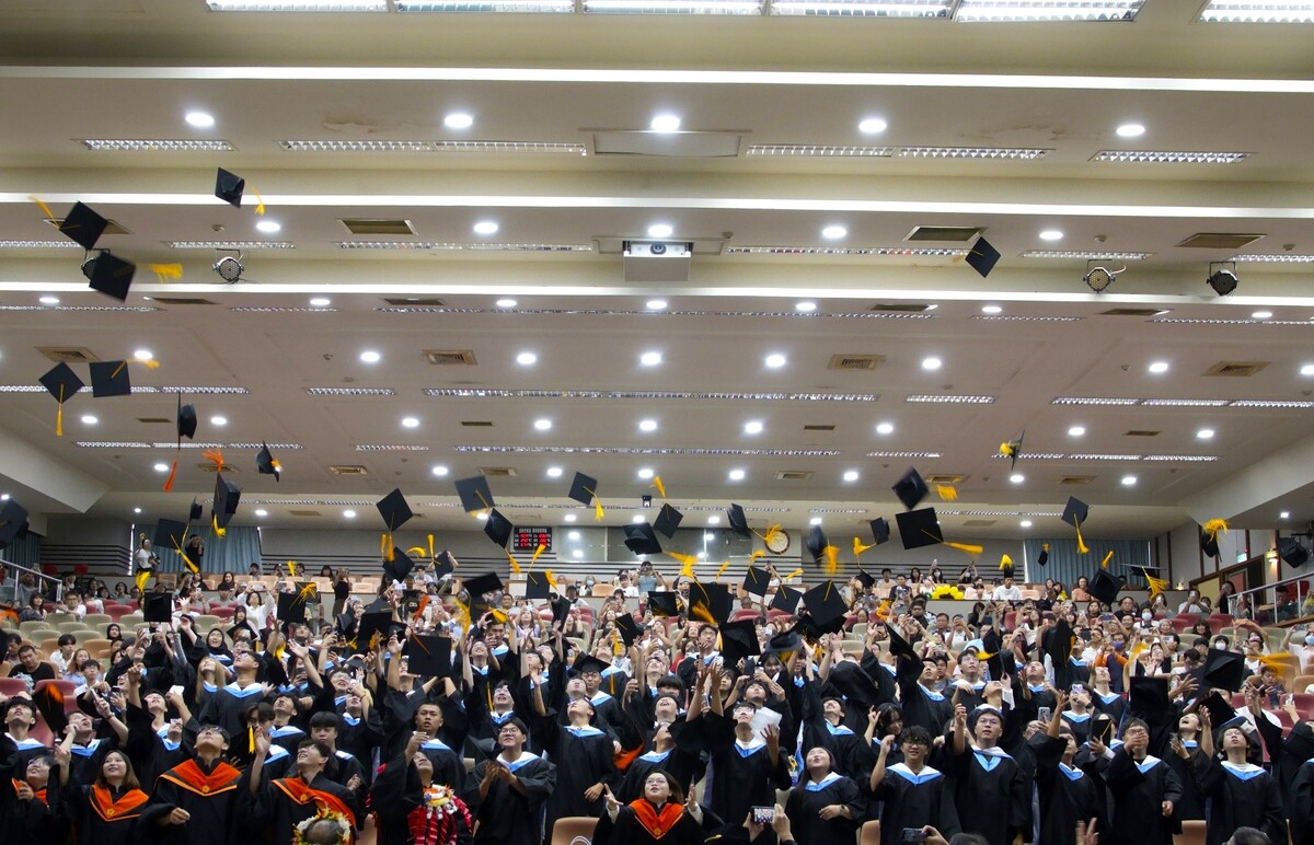 Graduates toss their caps as they prepare for the next chapter of their lives.Image